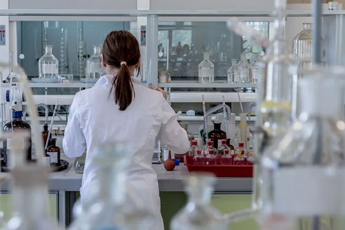 A female scientist tests all-natural hemp CBD in a lab.