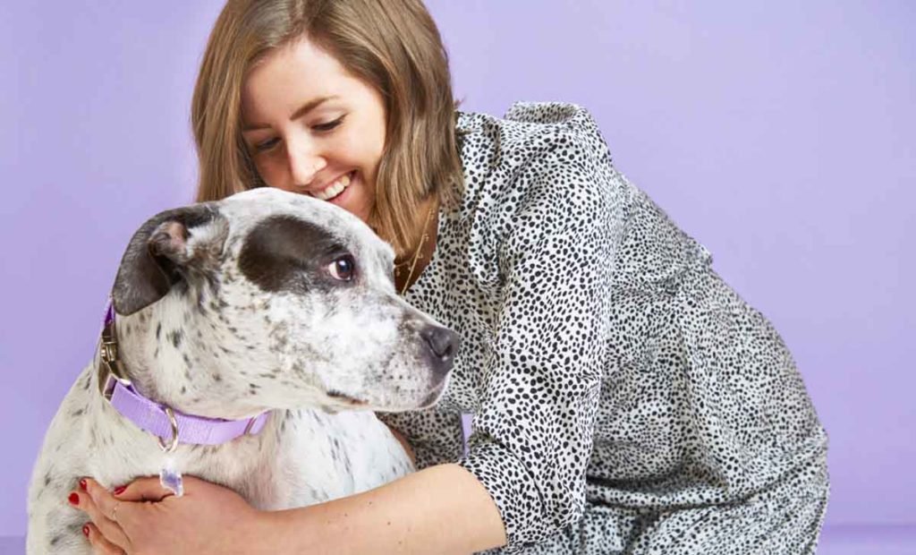 dog smiling with guardian